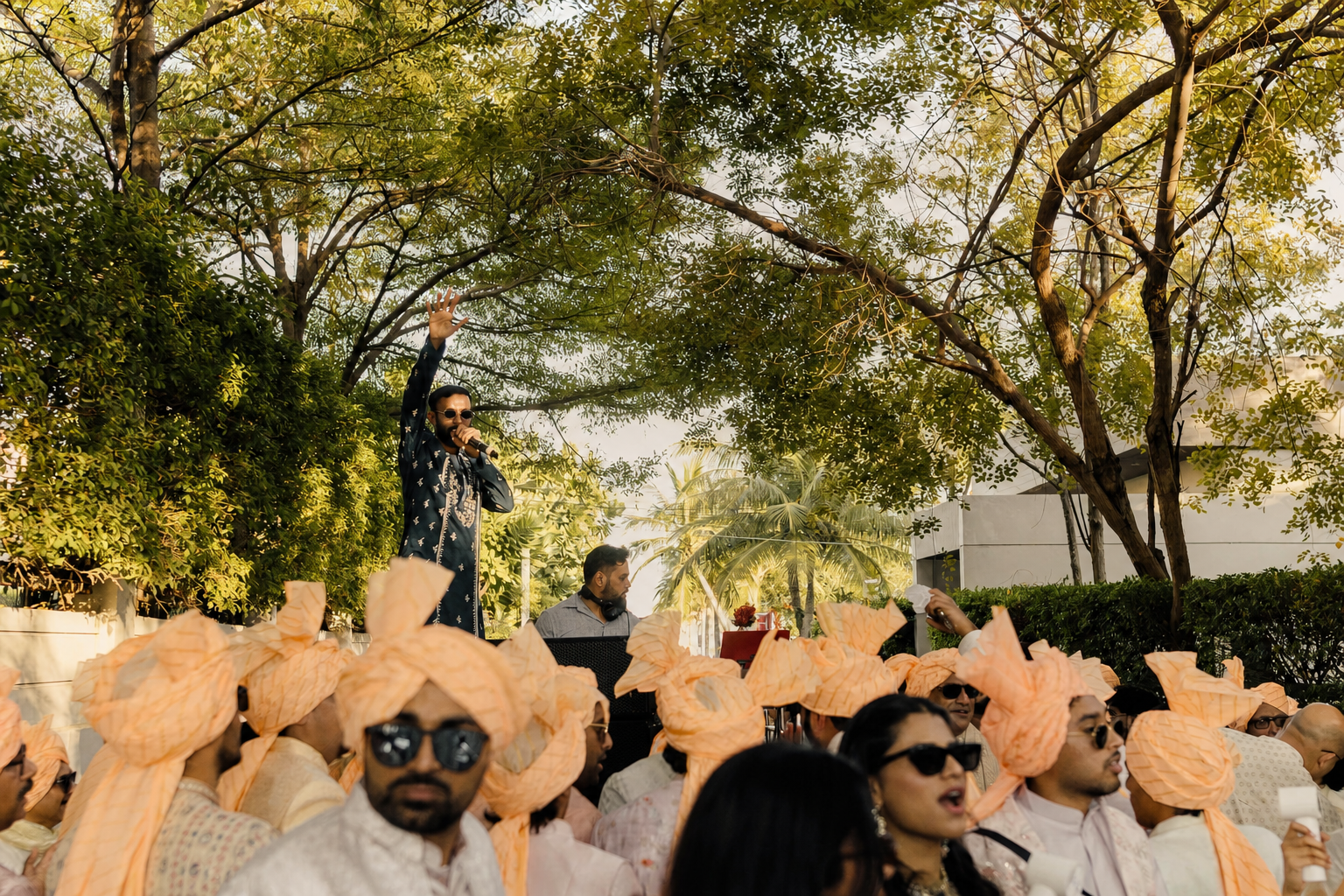 Vishaal energising guests at a daytime Indian wedding