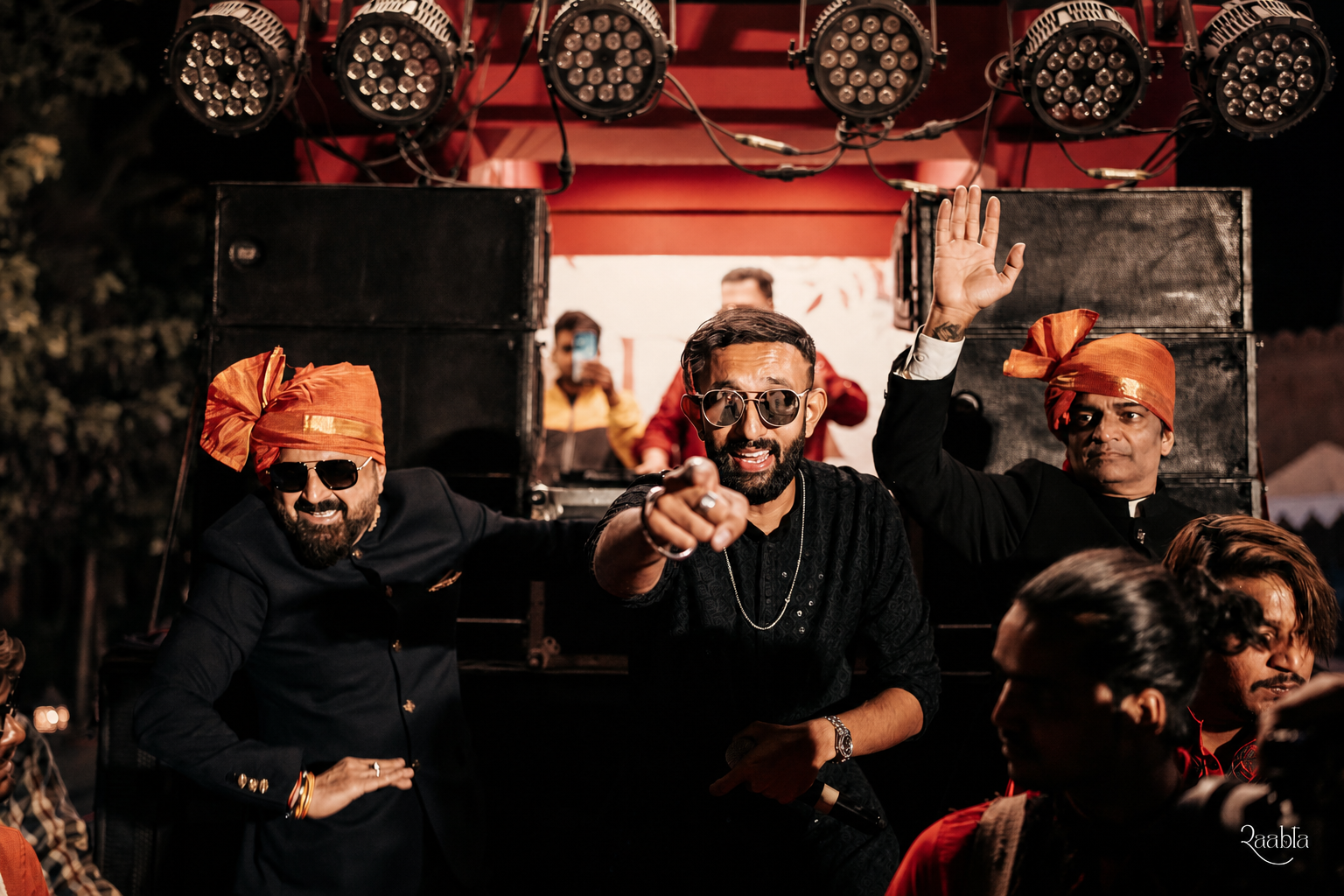 Vishaal energising guests during a vibrant wedding baraat
